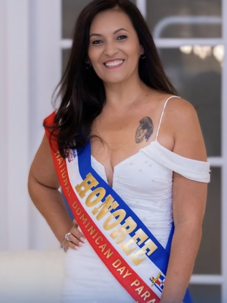 Woman wearing a custom Honoree sash at a benefit gala